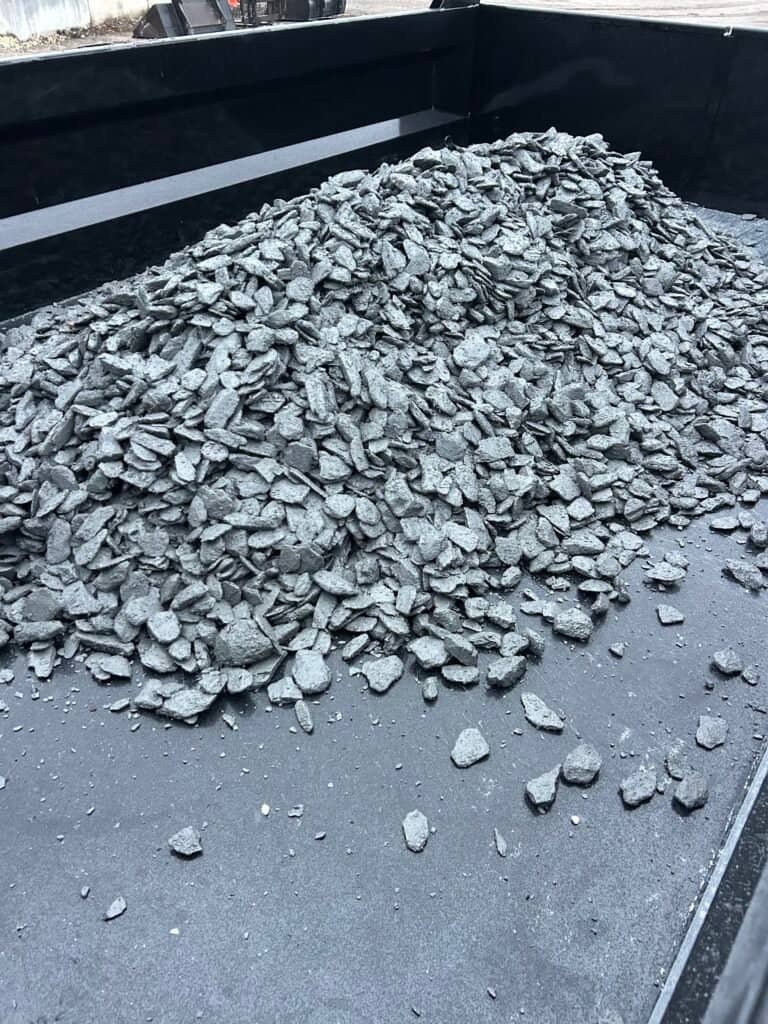 On-Call Hauler delivers landscape material including black slate rock chips