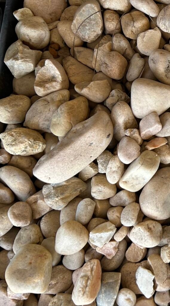 Large Brown River Rock delivery in Palm Beach County by On-Call Hauler.